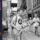Billy Bragg performing on a U.S. street, 1984. He is carrying his portastack PA system on his back. (Photo: Daily Express/Hulton Archive/Getty Images)